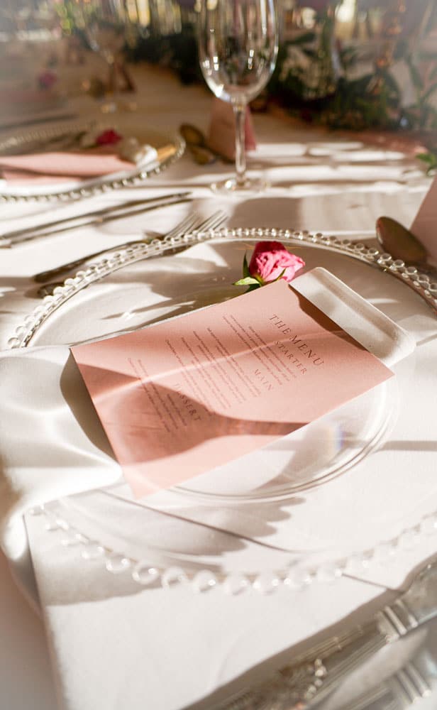 Table with an Owston Hall Menu on top of it